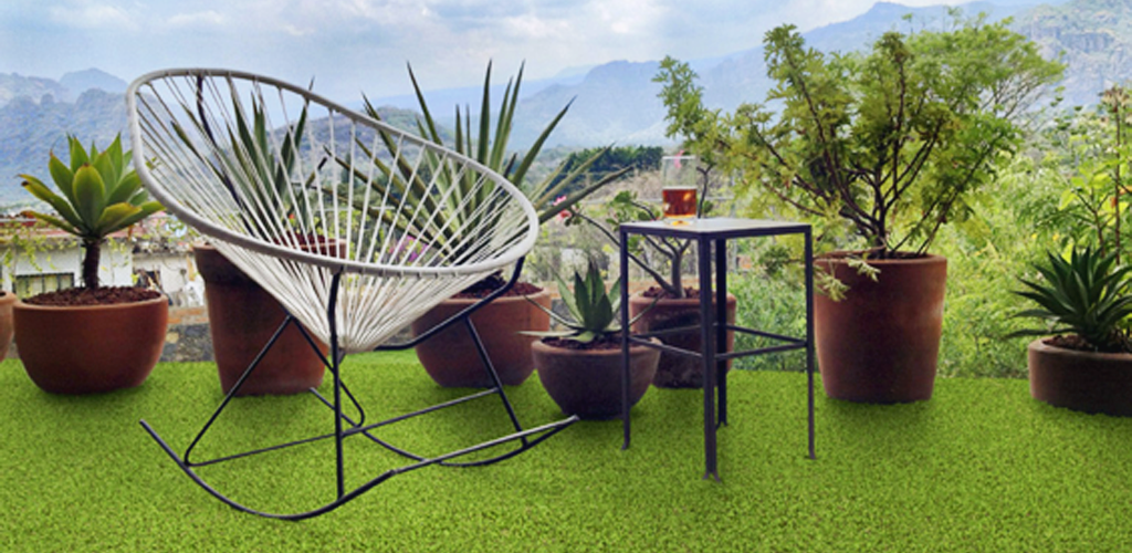Artificial grass on a terrace with garden furniture