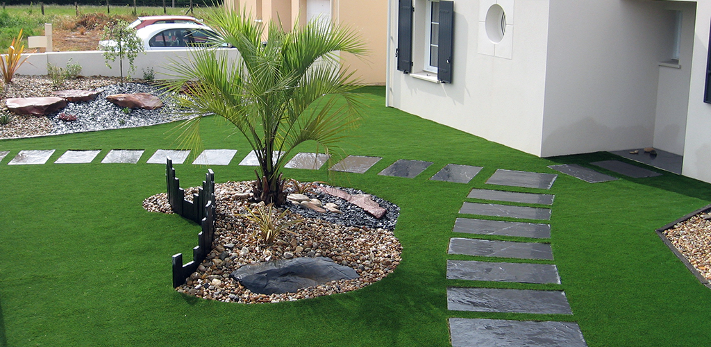 Artificial grass landscaping in front of a house
