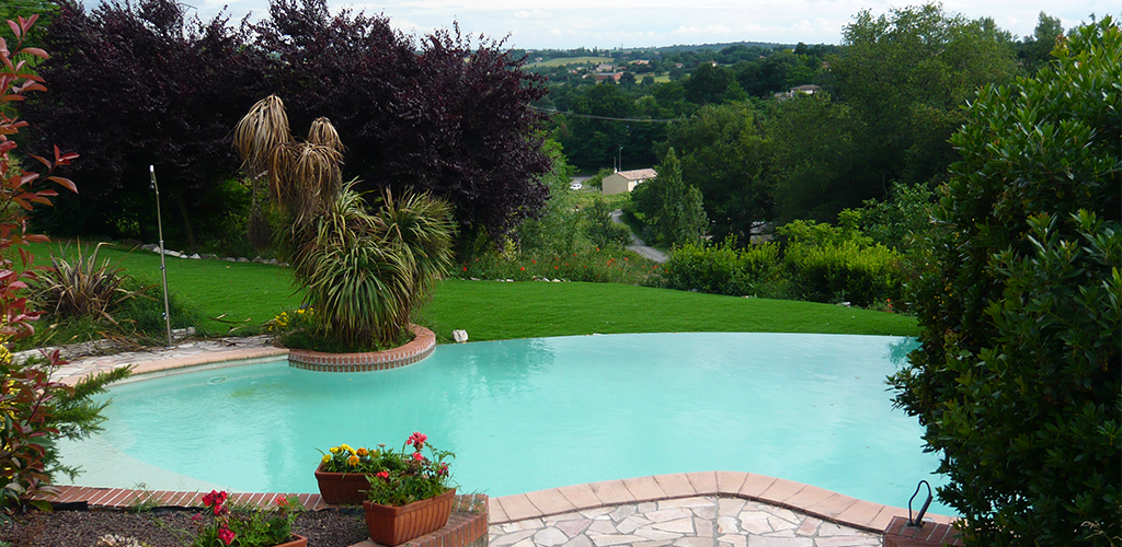 Artificial grass around a swimming pool