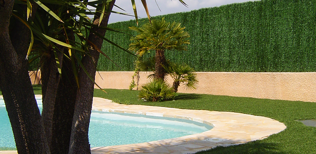 Artificial grass around a swimming pool