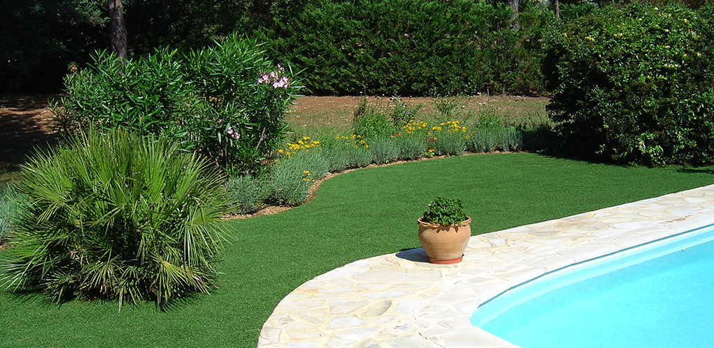 Artificial grass around a swimming pool