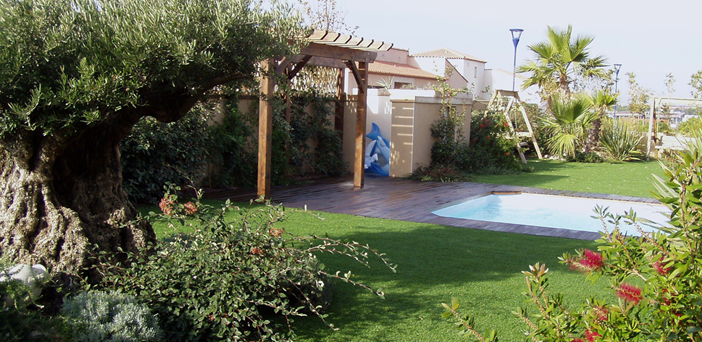 Artificial grass with plants and a swimming pool